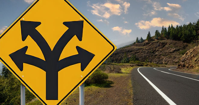 road sign with 4 direction arrows